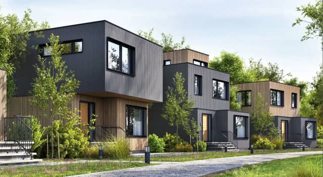 Nowoczesne domy o czystych liniach, elewacjach z drewna i aluminium – idealne dla ogrodów zimowych, pergoli i żaluzji aluminiowych